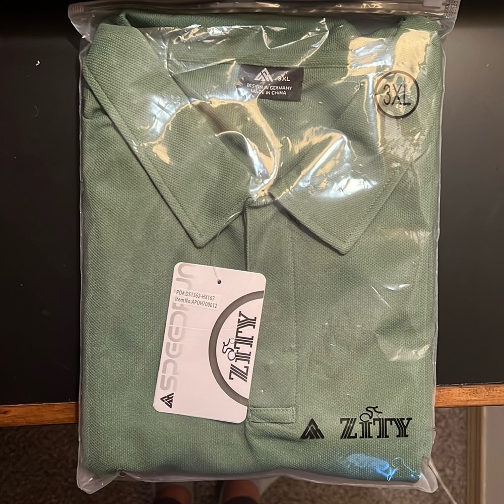 Brand new and never opened Zity polo shirt.